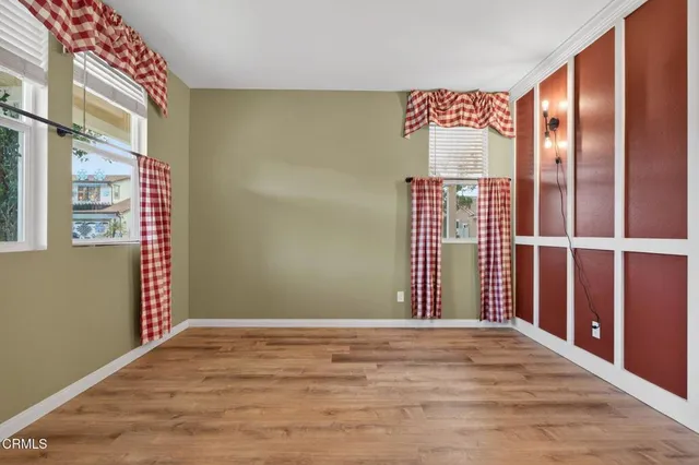 a view of an entryway with wooden floor