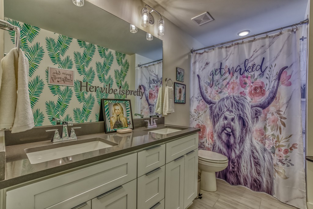 1519 Meridian Street, Unit 3 Nashville, TN 37207 - Photo 13 of 61 a bathroom with a granite countertop sink a toilet and a mirror