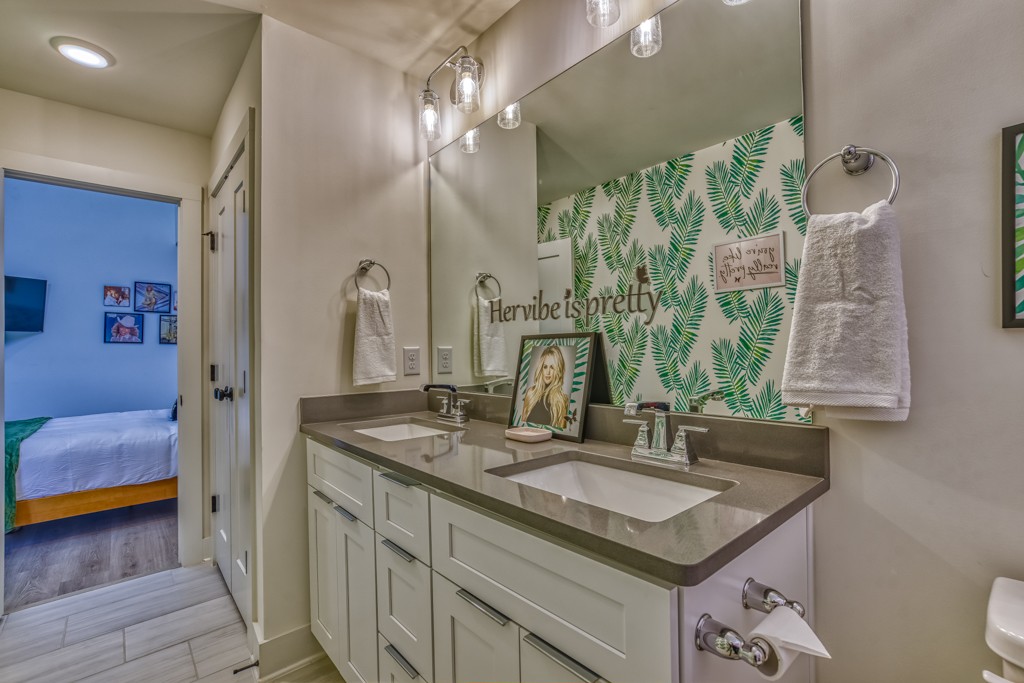 1519 Meridian Street, Unit 3 Nashville, TN 37207 - Photo 14 of 61 a bathroom with a granite countertop sink a large mirror and a shower