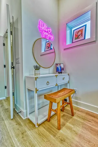 a view of a workspace with furniture and a window