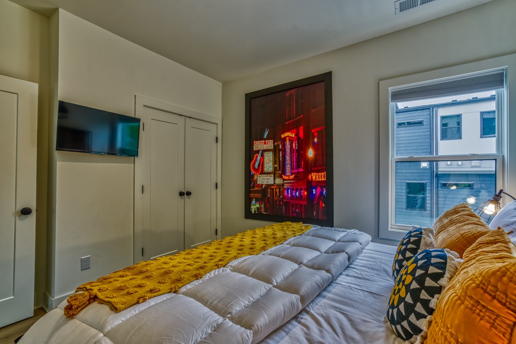 1519 Meridian Street, Unit 3 Nashville, TN 37207 - Photo 37 of 61 a bedroom with a bed and a dresser
