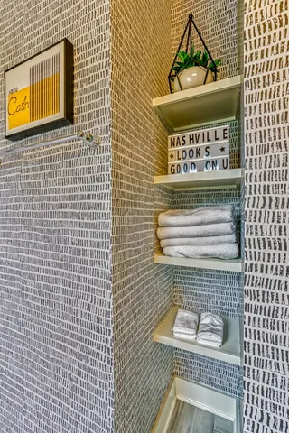 a view of kitchen with stainless steel appliances granite countertop a sink and granite counter tops