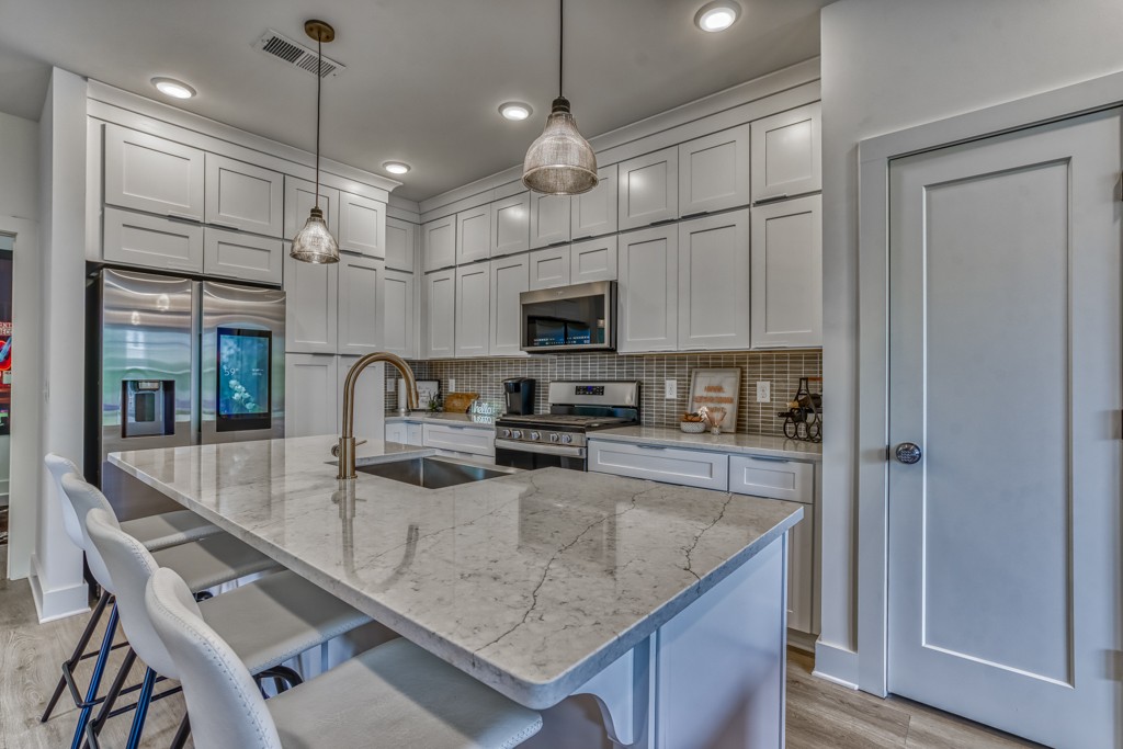 1519 Meridian Street, Unit 3 Nashville, TN 37207 - Photo 43 of 61 a kitchen with a center island and stainless steel appliances