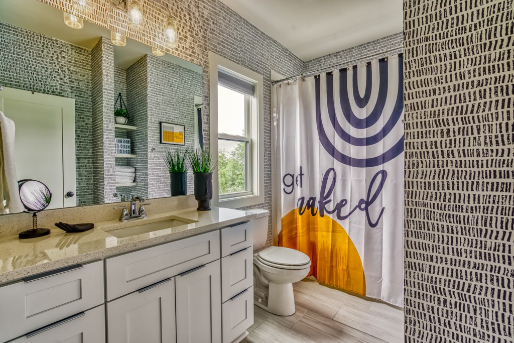 1519 Meridian Street, Unit 3 Nashville, TN 37207 - Photo 55 of 61 a bathroom with a granite countertop sink and a mirror