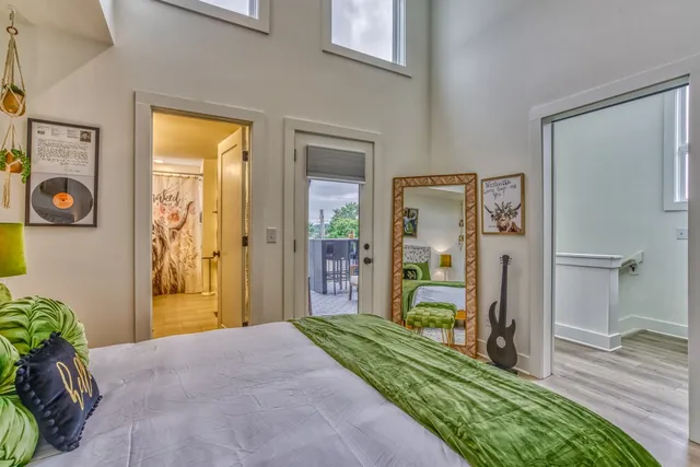 a kitchen with stainless steel appliances granite countertop a table chairs microwave and sink