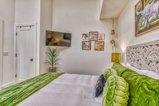 a bathroom with a granite countertop sink a toilet and a mirror