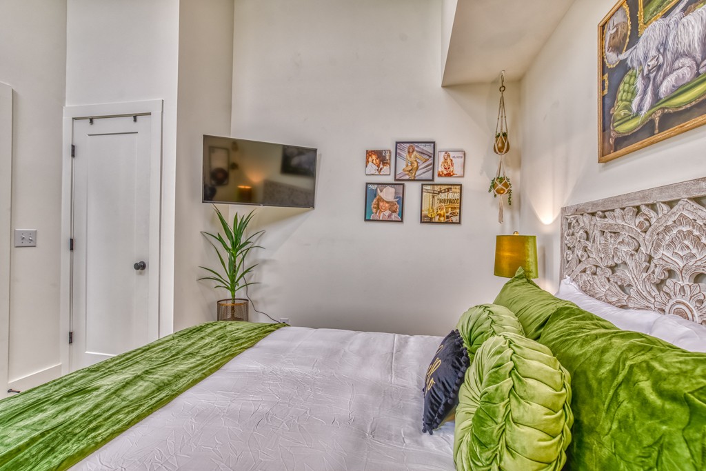 1519 Meridian Street, Unit 3 Nashville, TN 37207 - Photo 10 of 61 a bedroom with a bed and painting on the wall