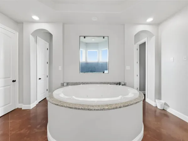 a view of living room kitchen with stainless steel appliances granite countertop furniture and fireplace
