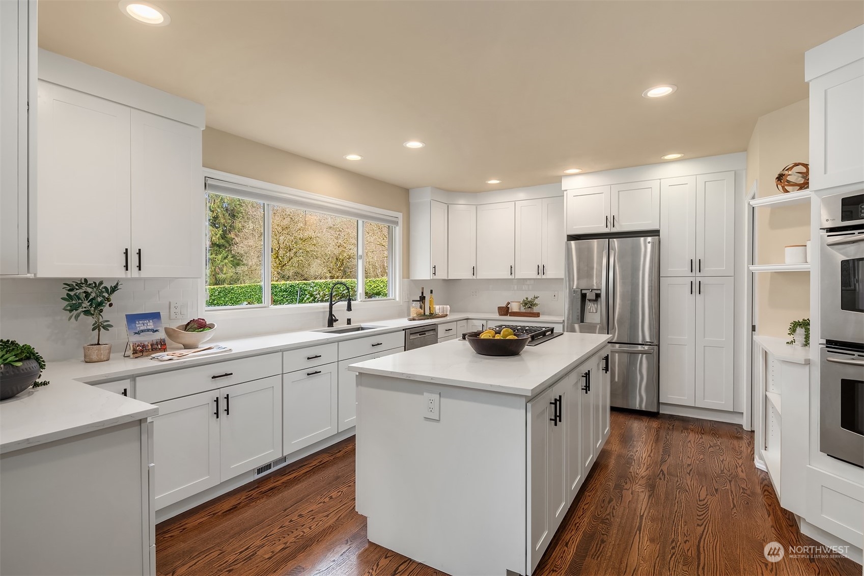 15425 192nd Court Northeast Woodinville, WA 98072 - Photo 12 of 33 a kitchen with a sink stove and refrigerator
