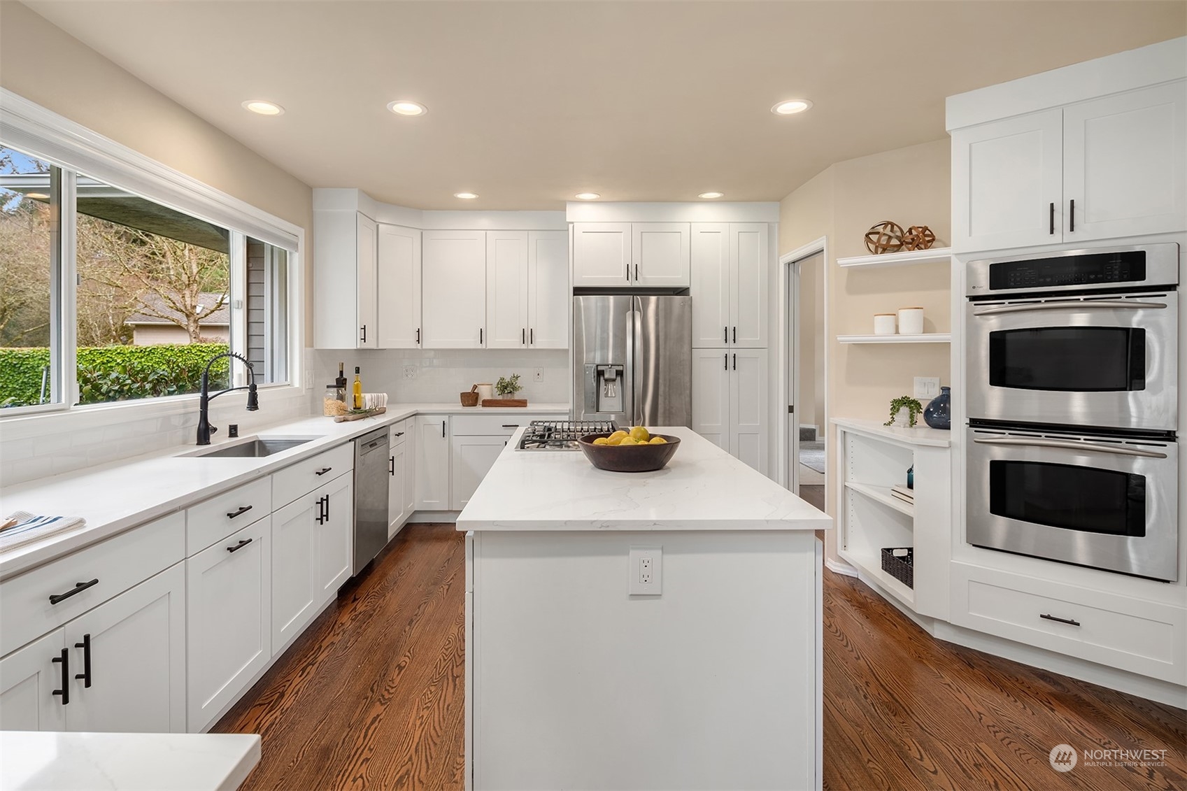 15425 192nd Court Northeast Woodinville, WA 98072 - Photo 13 of 33 a kitchen with a sink a counter top space stainless steel appliances and a window