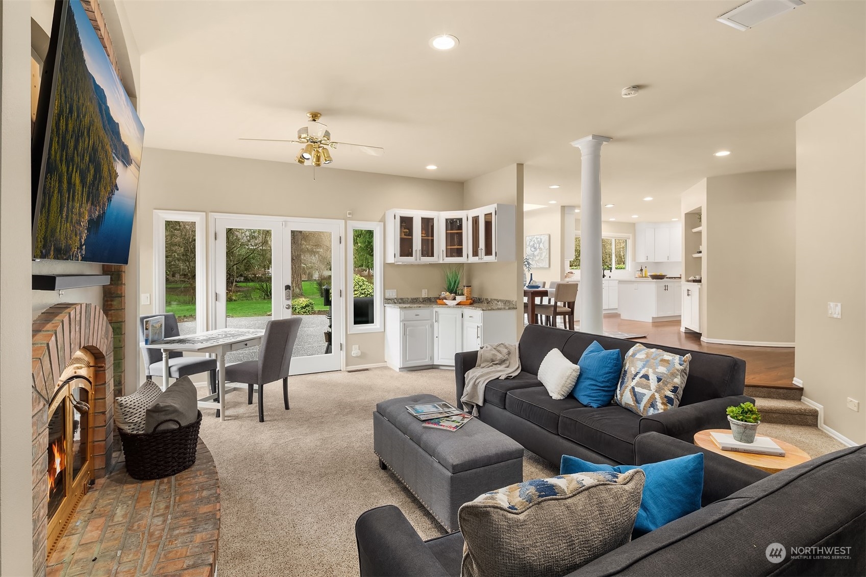 15425 192nd Court Northeast Woodinville, WA 98072 - Photo 17 of 33 a living room with furniture and a fireplace