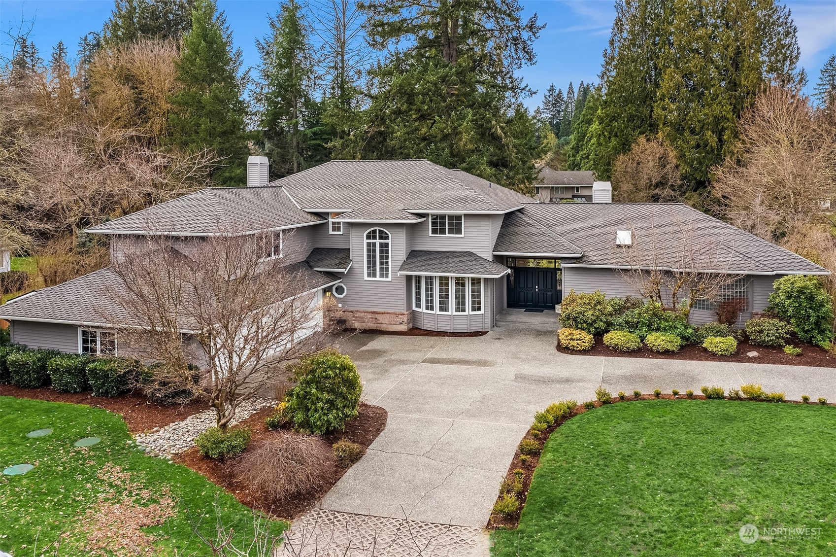 15425 192nd Court Northeast Woodinville, WA 98072 - Photo 2 of 33 a view of a house with a yard and potted plants