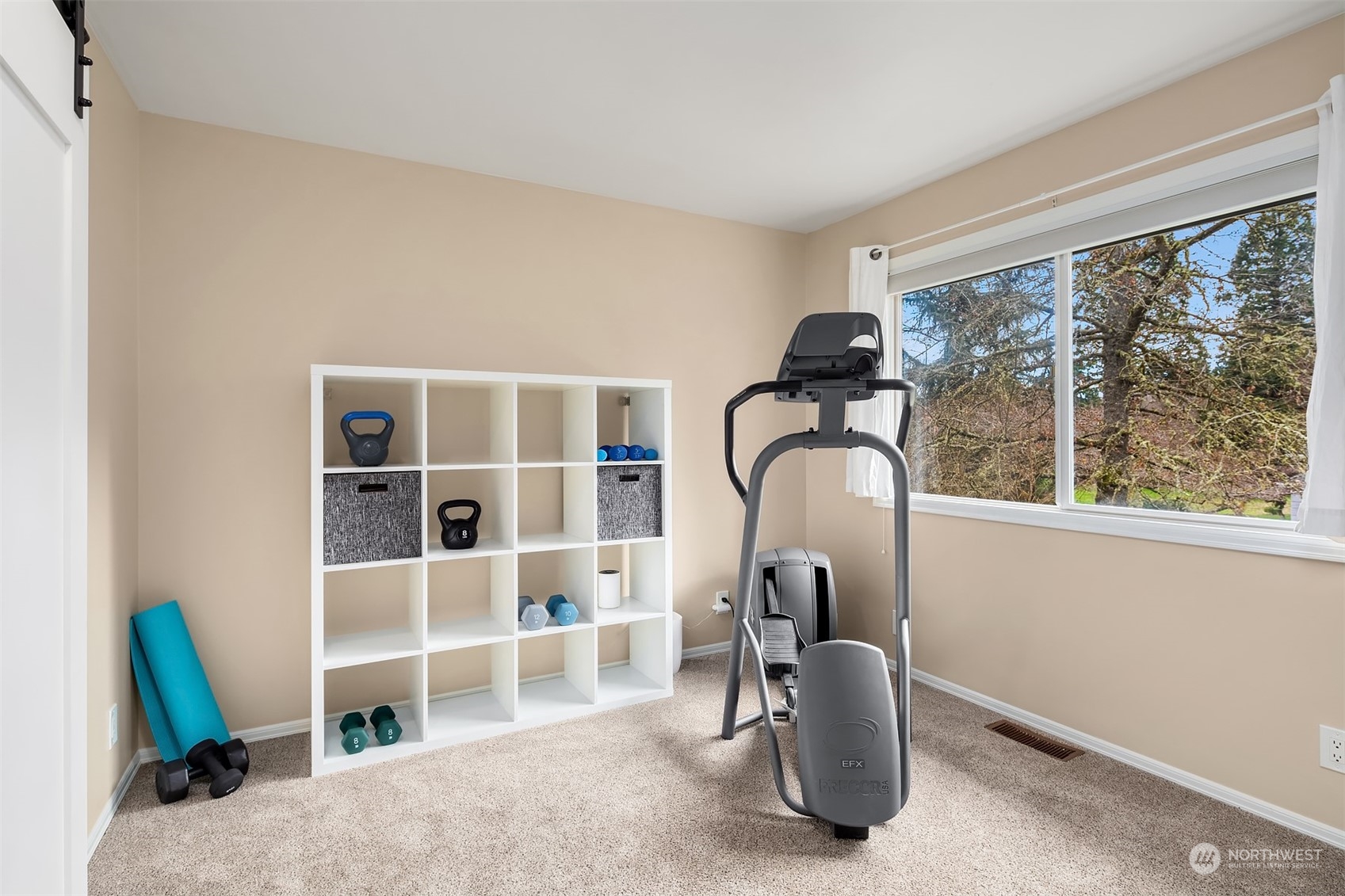 15425 192nd Court Northeast Woodinville, WA 98072 - Photo 25 of 33 a living room with furniture and a window