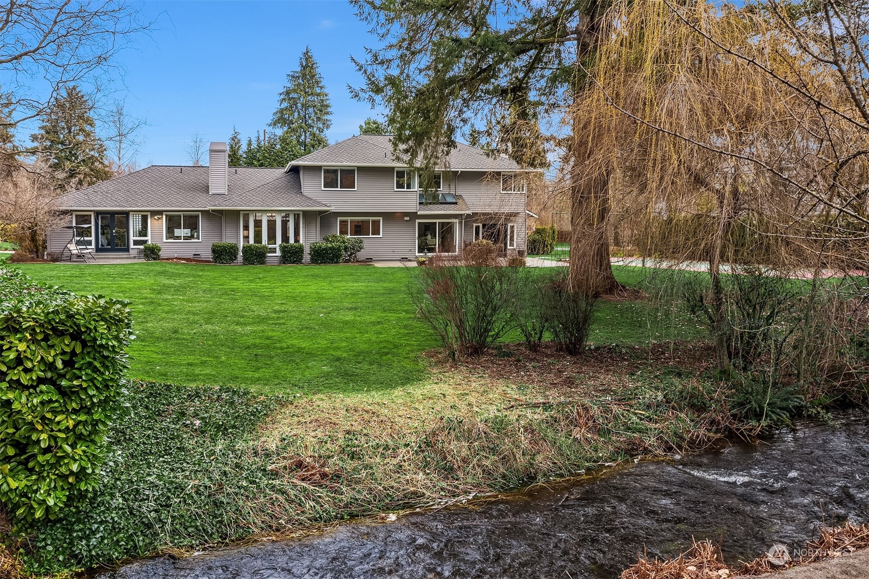 15425 192nd Court Northeast Woodinville, WA 98072 - Photo 3 of 33 a front view of a house with garden