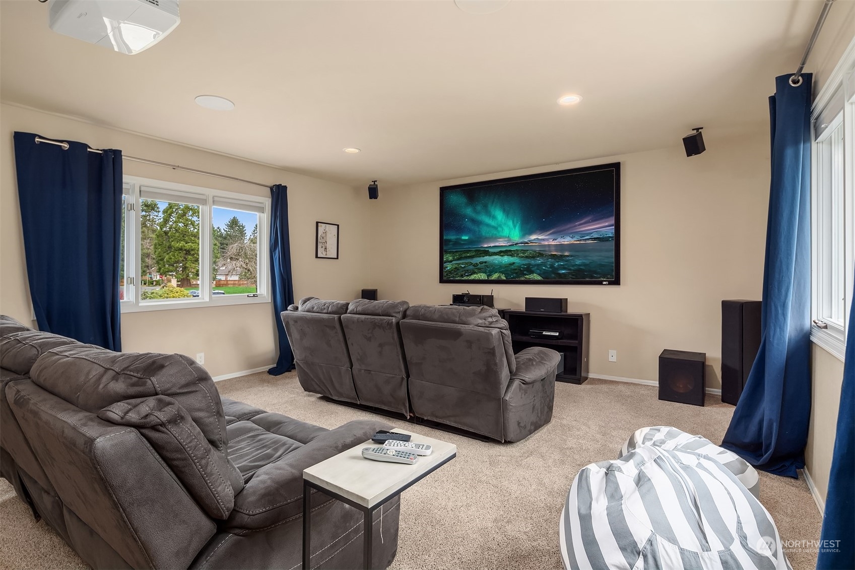 15425 192nd Court Northeast Woodinville, WA 98072 - Photo 31 of 33 a living room with furniture and a flat screen tv