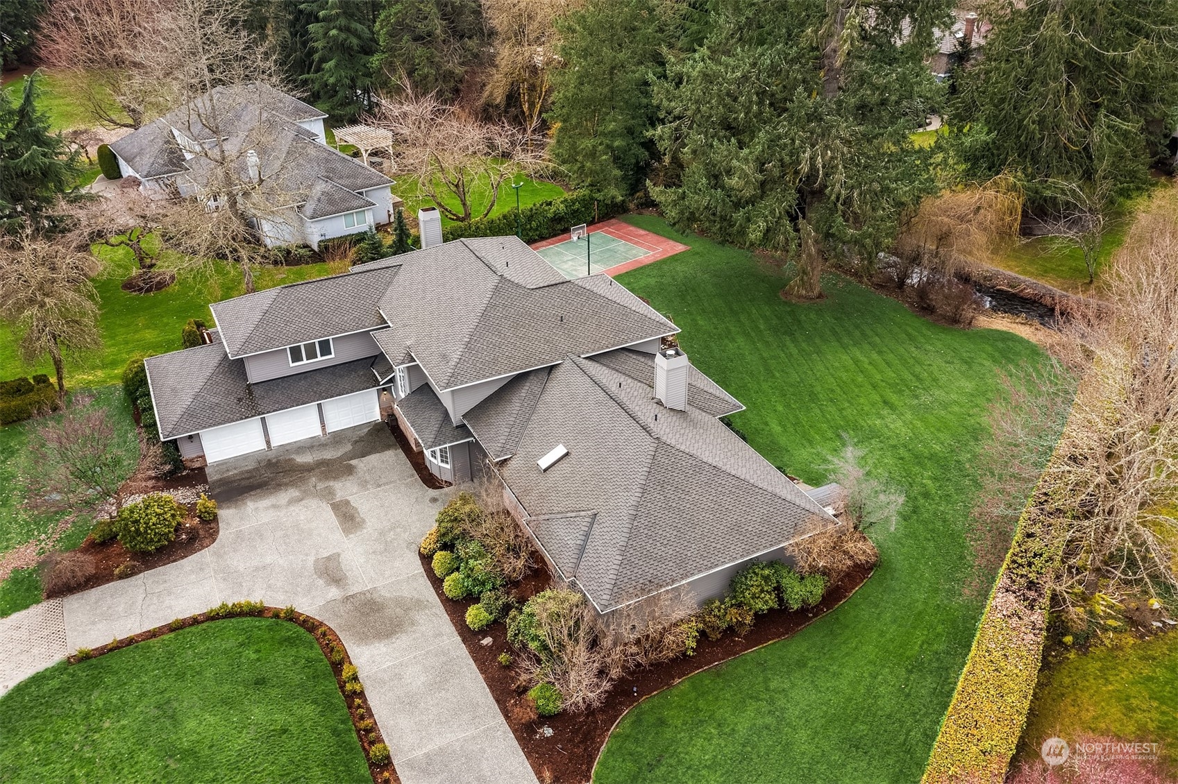 15425 192nd Court Northeast Woodinville, WA 98072 - Photo 5 of 33 an aerial view of a house with garden space and street view