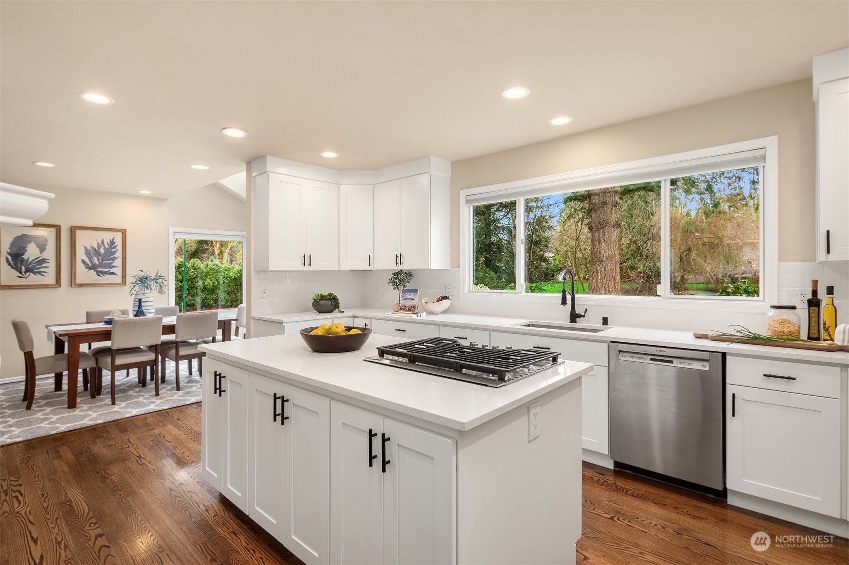15425 192nd Court Northeast Woodinville, WA 98072 - Photo 10 of 33 a kitchen with a stove sink cabinets and wooden floor