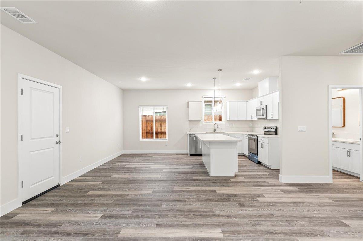 1415 Villa Way Modesto, CA 95351 - Photo 12 of 37 a view of a kitchen and wooden floor
