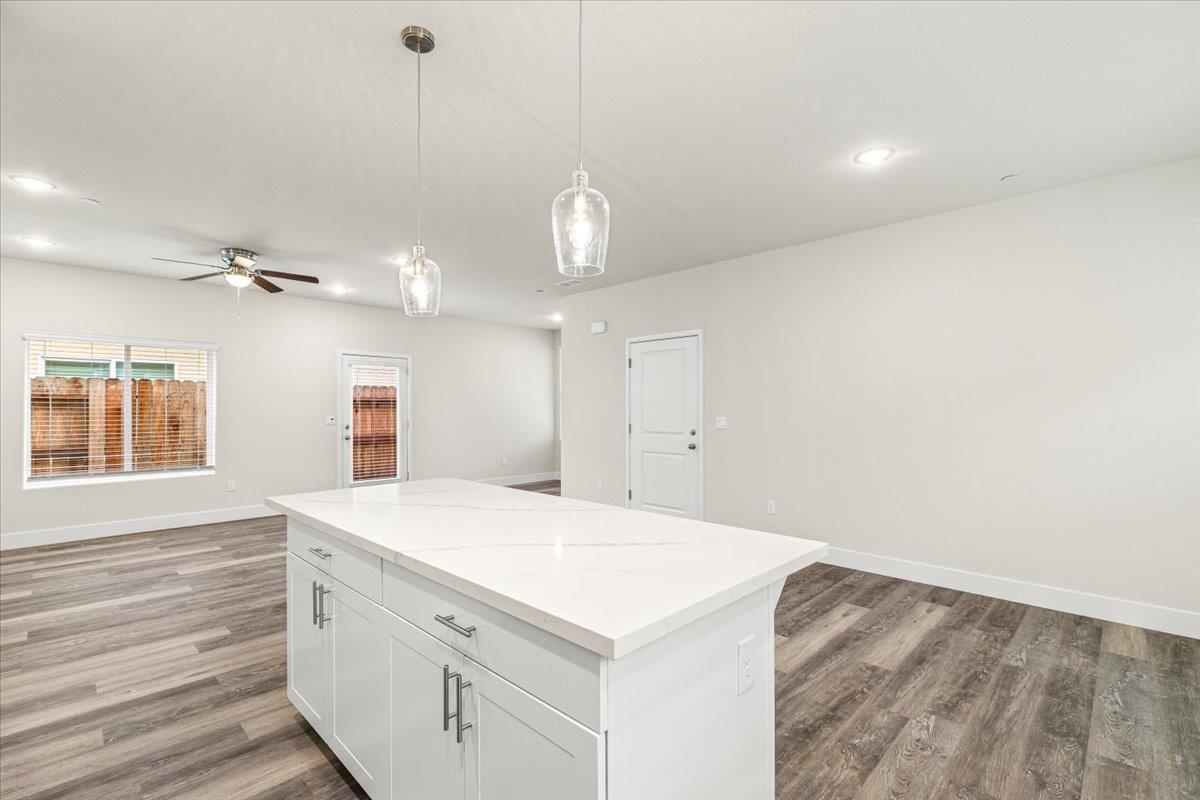 1415 Villa Way Modesto, CA 95351 - Photo 19 of 37 a view of a kitchen cabinets a sink and dishwasher with wooden floor