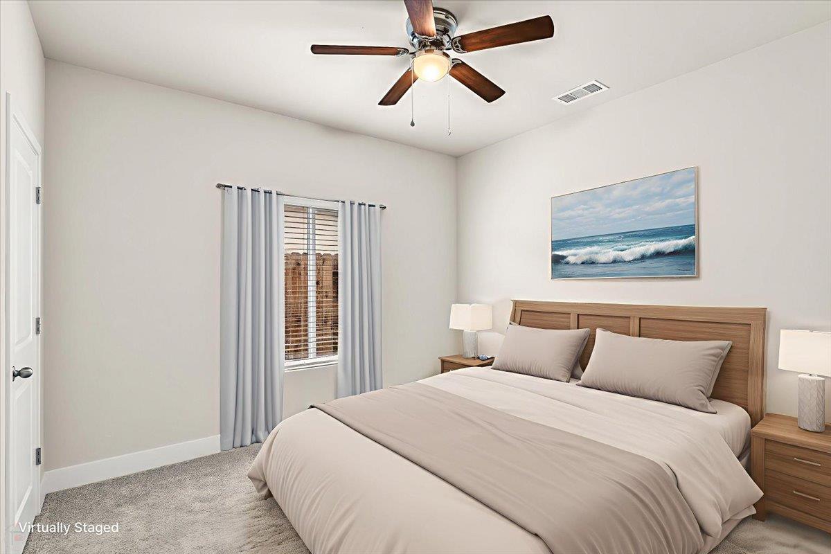 1415 Villa Way Modesto, CA 95351 - Photo 22 of 37 a bedroom with a large bed and a window