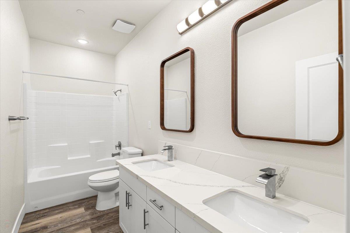 1415 Villa Way Modesto, CA 95351 - Photo 23 of 37 a bathroom with a toilet sink and mirror