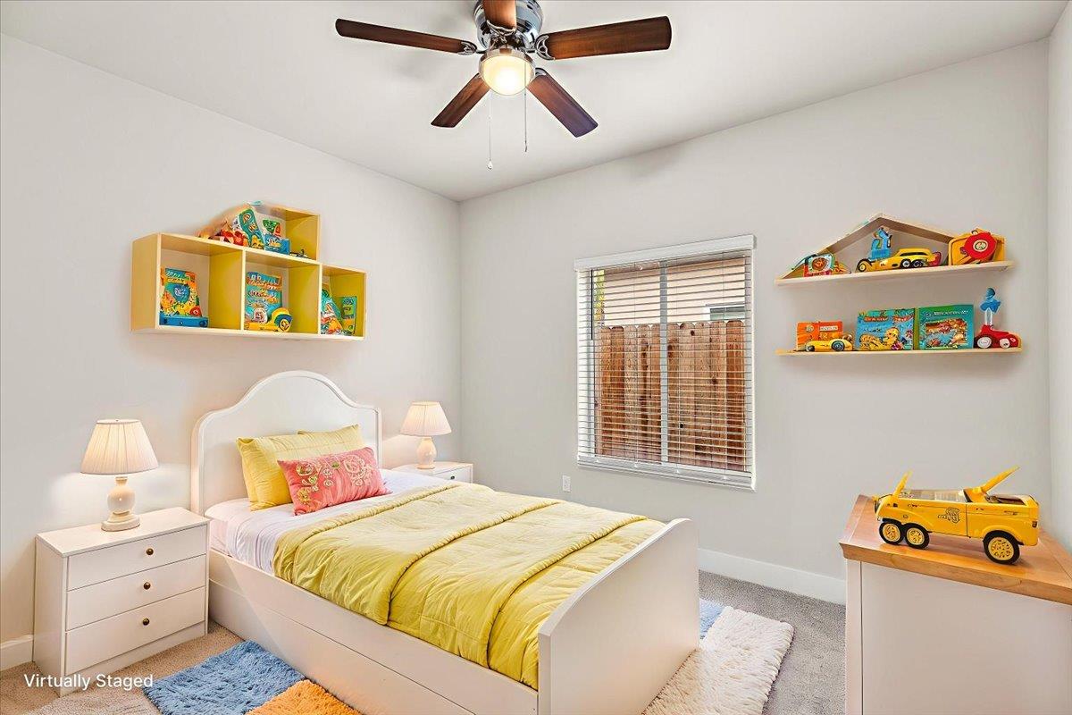 1415 Villa Way Modesto, CA 95351 - Photo 26 of 37 a bedroom with a bed and a window