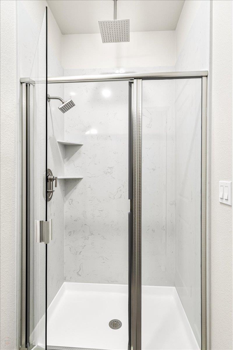 1415 Villa Way Modesto, CA 95351 - Photo 33 of 37 a bathroom with a glass shower door