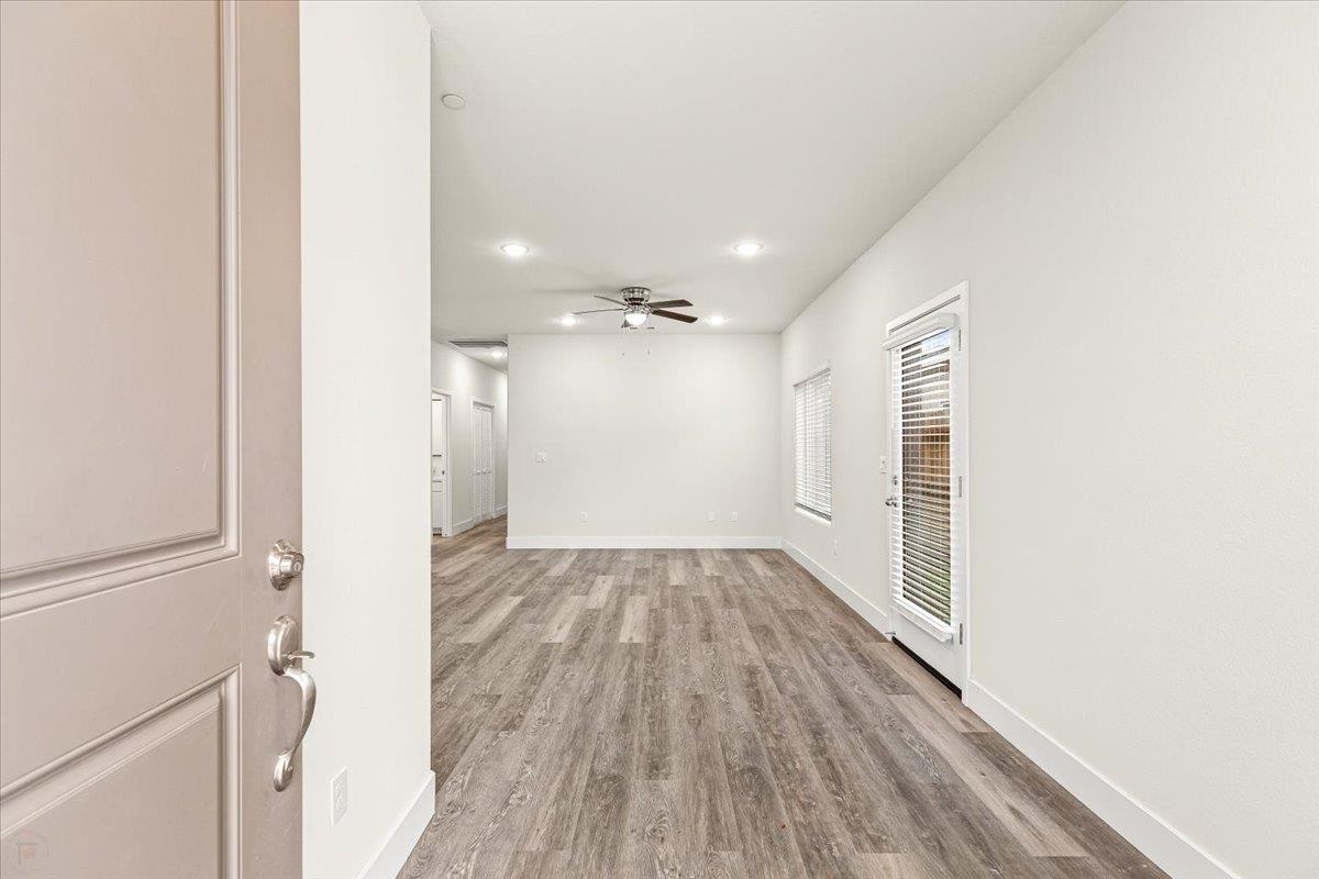 1415 Villa Way Modesto, CA 95351 - Photo 5 of 37 a view of a hallway with wooden floor and a hallway