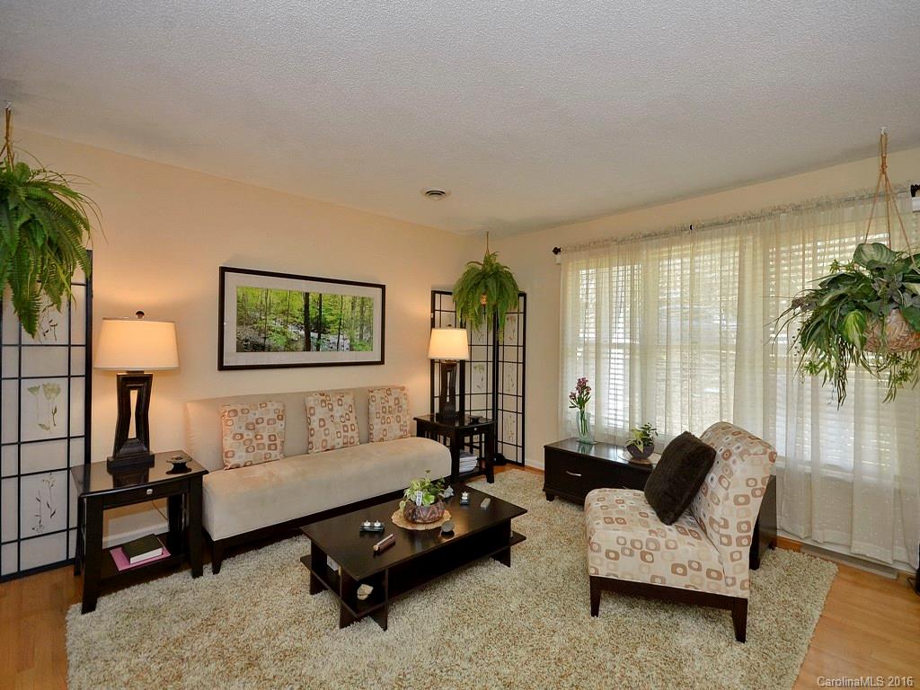 137 Brandon Road Hendersonville, NC 28739 - Photo 3 of 20 a living room with furniture and a large window