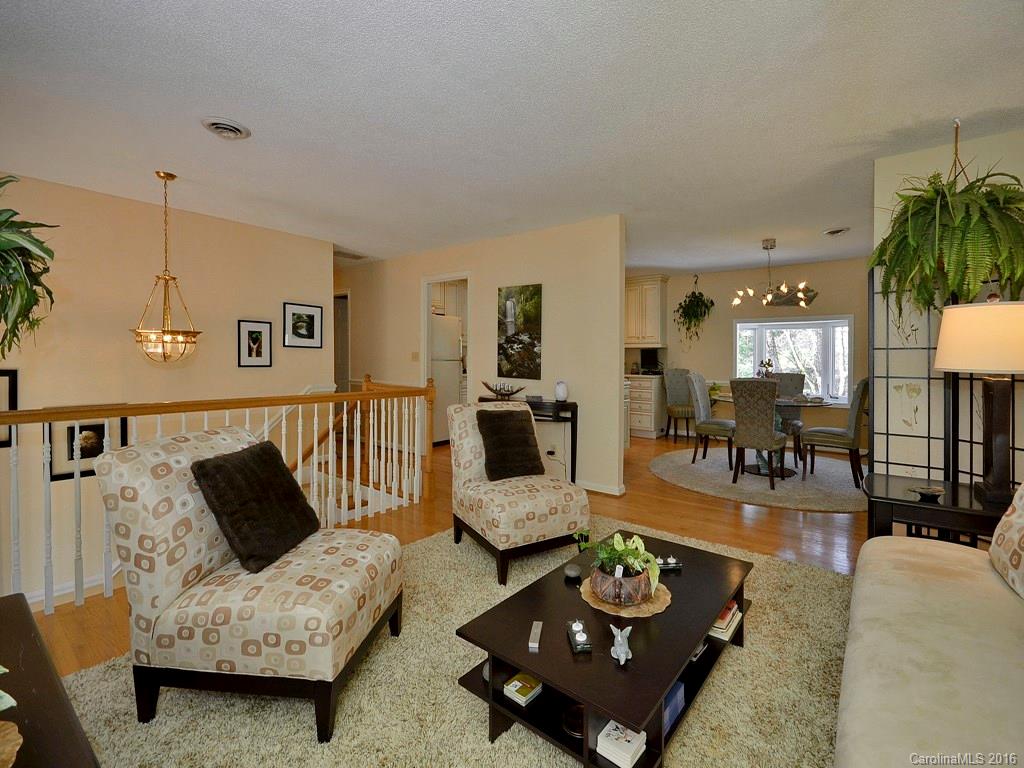137 Brandon Road Hendersonville, NC 28739 - Photo 4 of 20 a living room with furniture and wooden floor