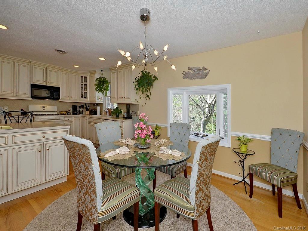 137 Brandon Road Hendersonville, NC 28739 - Photo 5 of 20 a dining room with furniture a window and kitchen view