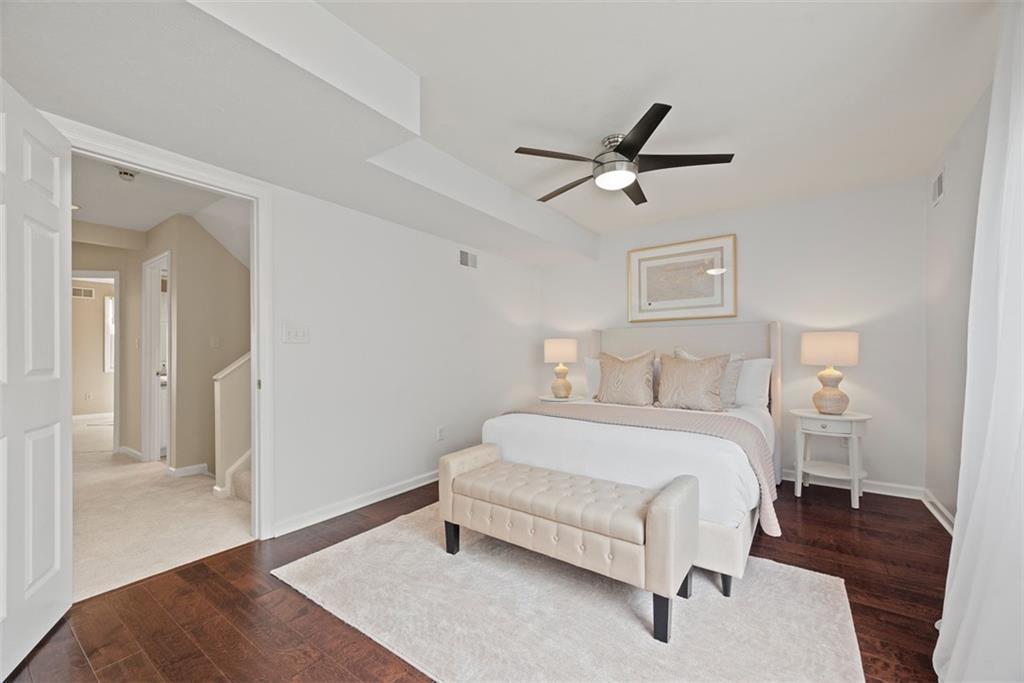 7 Waterside Place Pittsburgh, PA 15222 - Photo 18 of 43 a bedroom with a bed and a table with wooden floor