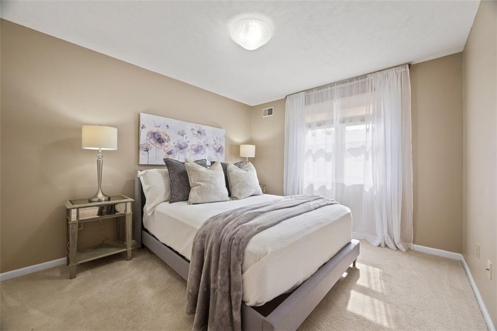 7 Waterside Place Pittsburgh, PA 15222 - Photo 21 of 43 a bedroom with a bed and a night stand