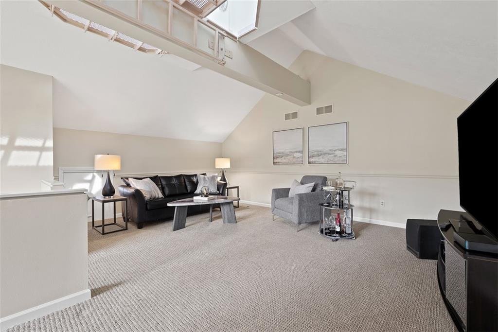 7 Waterside Place Pittsburgh, PA 15222 - Photo 25 of 43 a living room with furniture and a flat screen tv