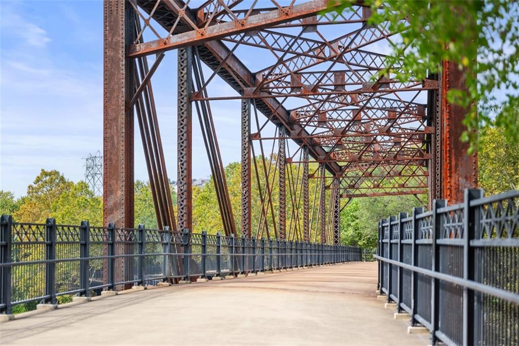 7 Waterside Place Pittsburgh, PA 15222 - Photo 36 of 43 a view of a building with a small yard and wooden fence