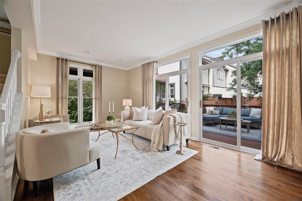7 Waterside Place Pittsburgh, PA 15222 - Photo 6 of 43 a living room with furniture a window and wooden floor