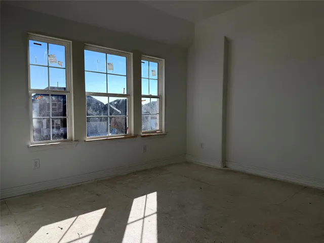 an empty room with windows