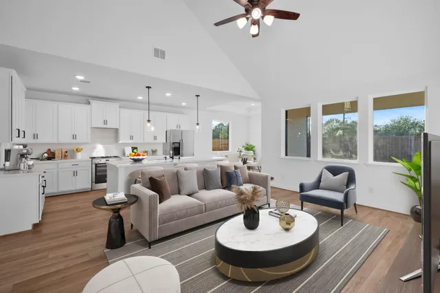 a living room with furniture and a large window