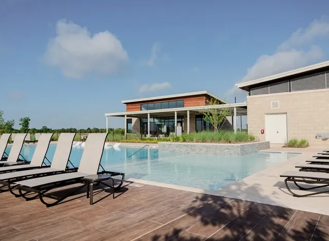 a kitchen with a refrigerator and a table