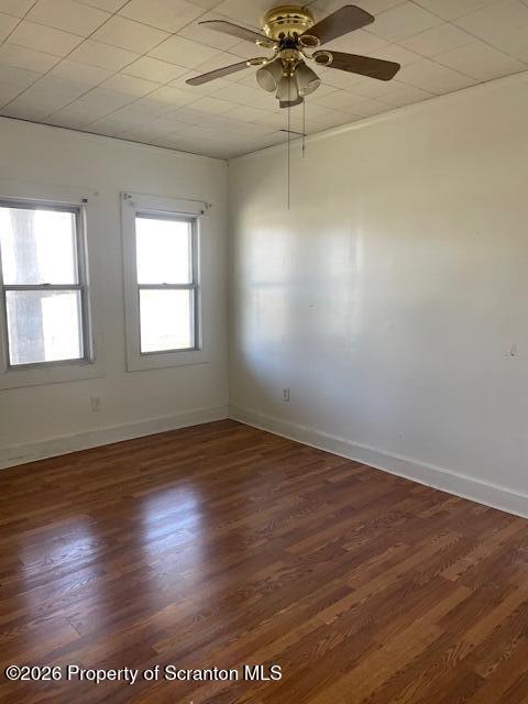 210 Crane Street Scranton, PA 18505 - Photo 6 of 17 an empty room with wooden floor and windows
