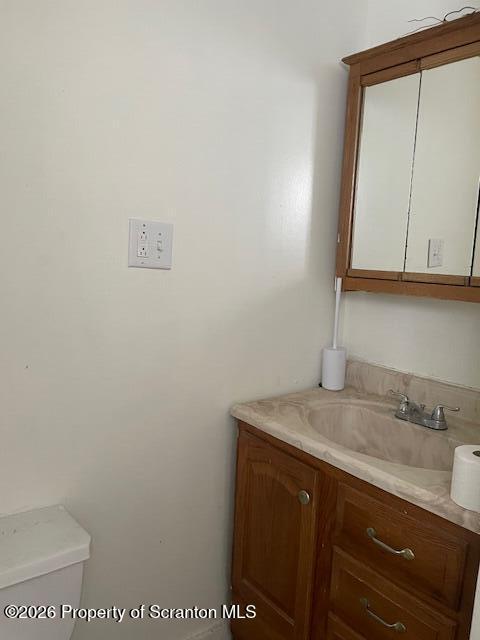 210 Crane Street Scranton, PA 18505 - Photo 7 of 17 a bathroom with a sink a vanity and mirror