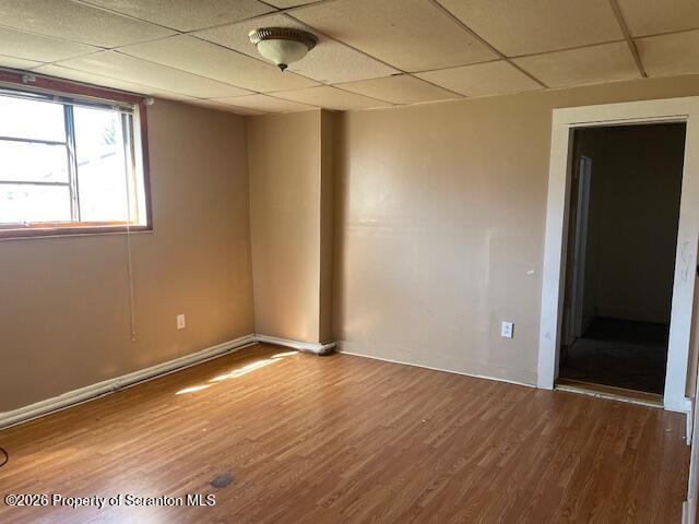 210 Crane Street Scranton, PA 18505 - Photo 10 of 17 an empty room with wooden floor and windows