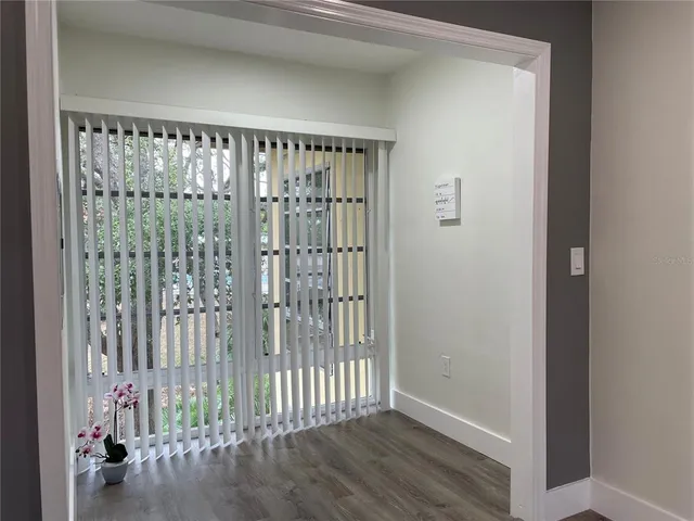 a view of a porch with wooden floor