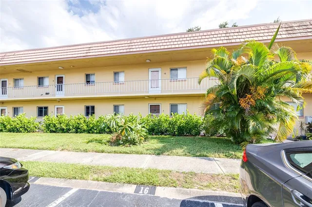 a front view of a building with garden