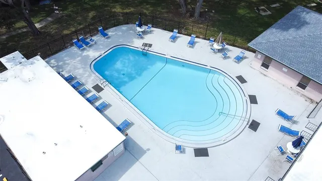 an aerial view of a house with outdoor space