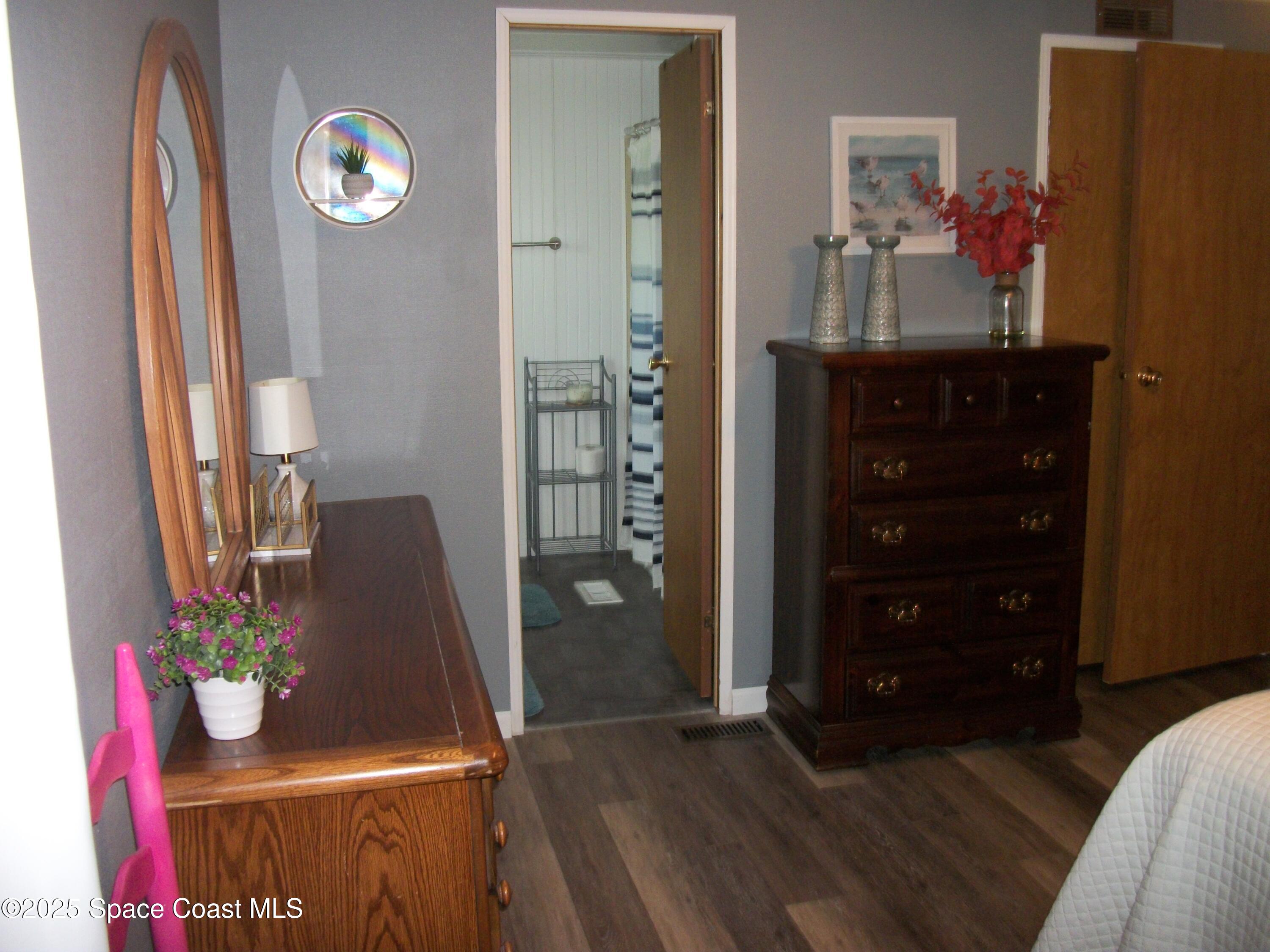 1972 Mango Street Northeast Palm Bay, FL 32905 - Photo 17 of 41 a room with furniture and wooden floor