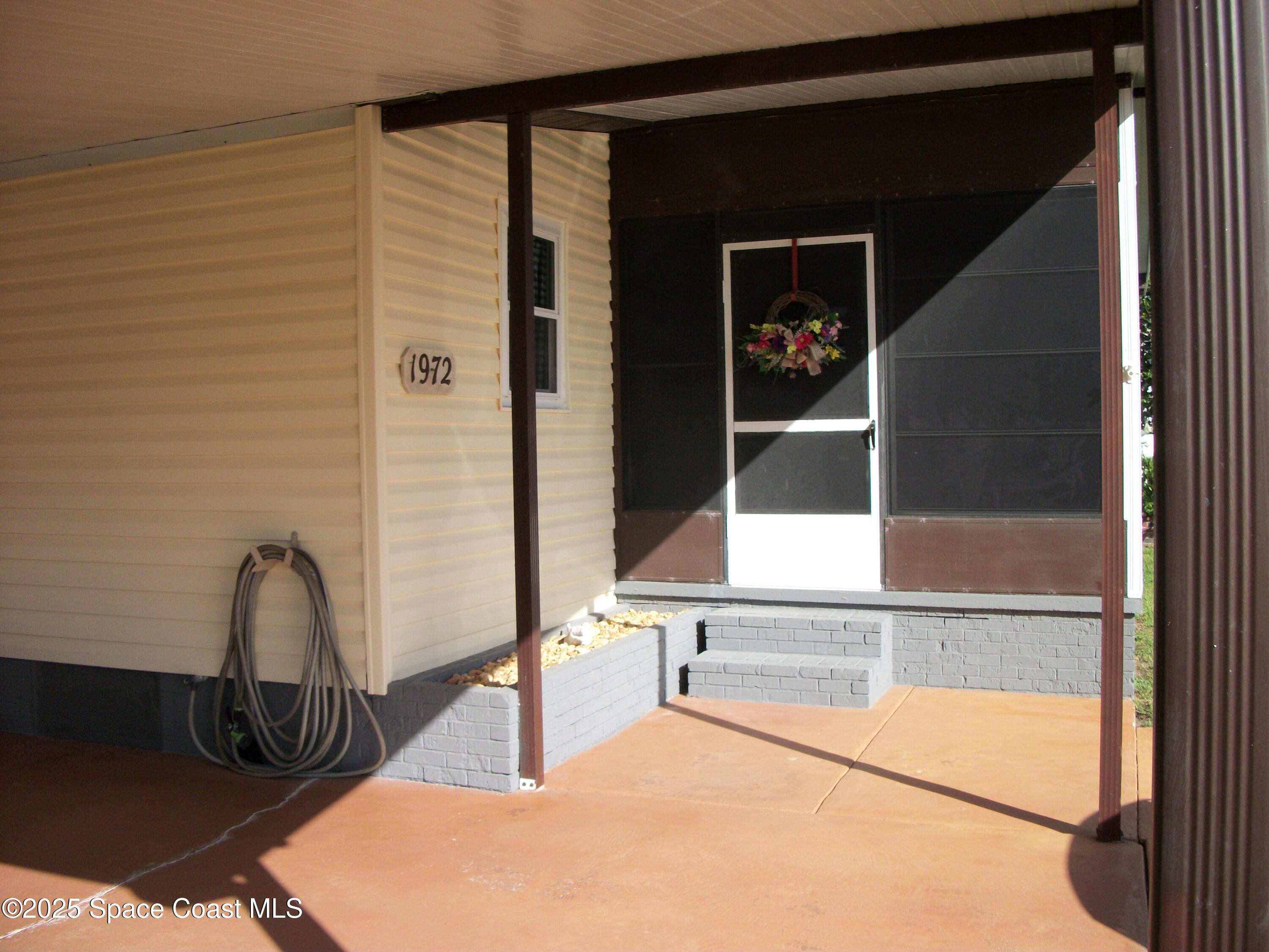 1972 Mango Street Northeast Palm Bay, FL 32905 - Photo 25 of 41 a view of a room with rack on the wall