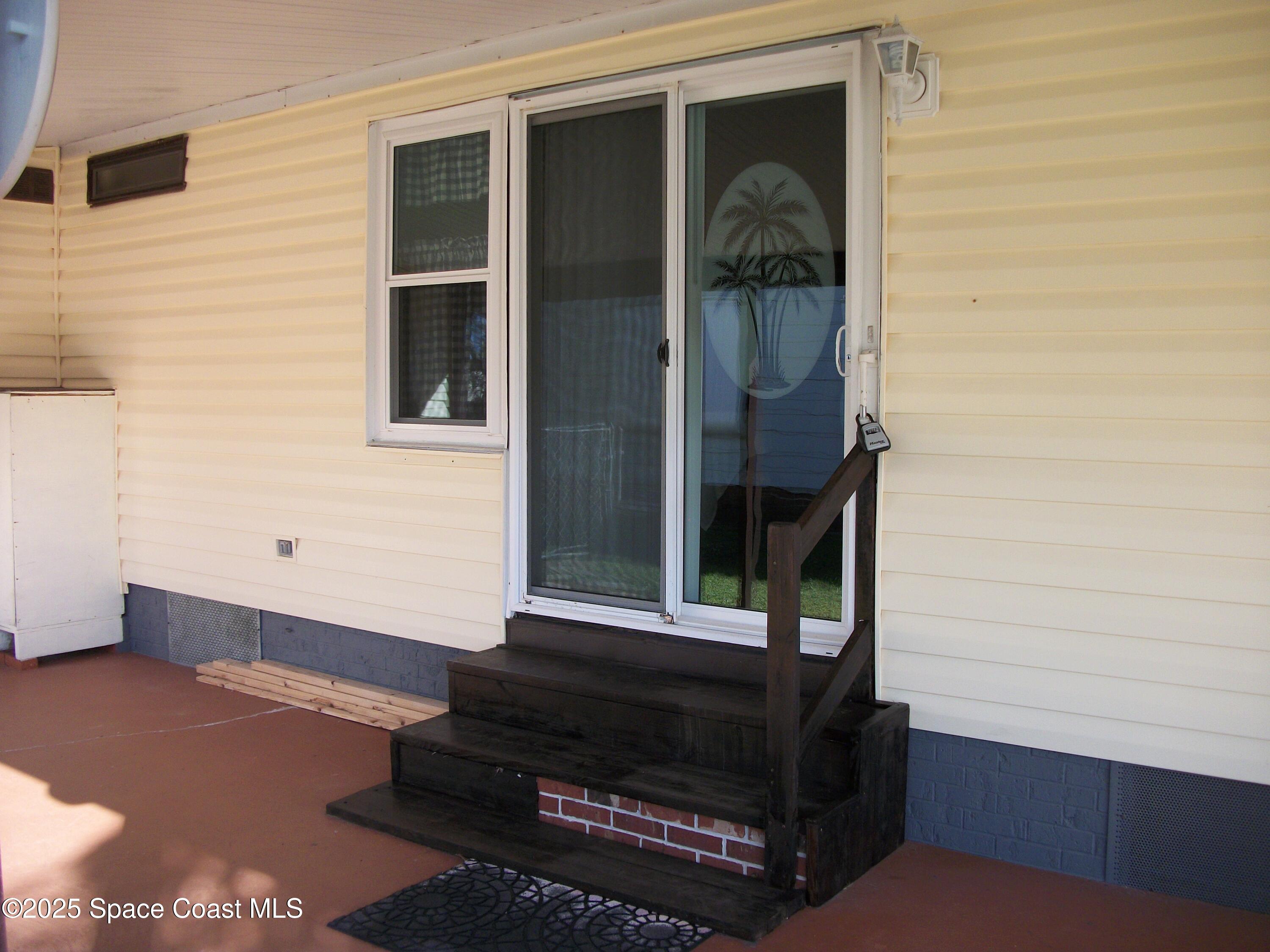 1972 Mango Street Northeast Palm Bay, FL 32905 - Photo 26 of 41 a front view of a house with a window