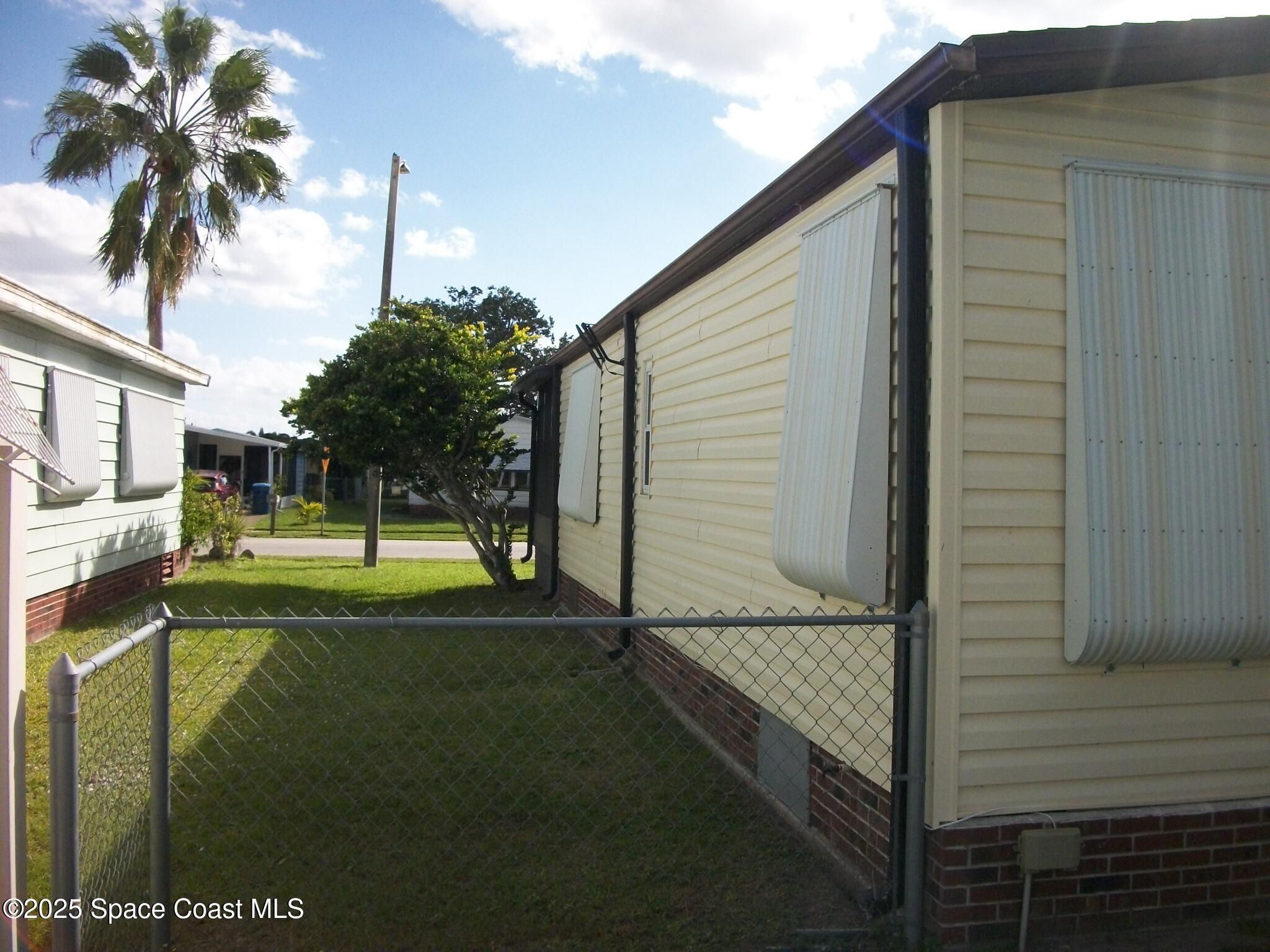 1972 Mango Street Northeast Palm Bay, FL 32905 - Photo 30 of 41 a view of backyard of a house