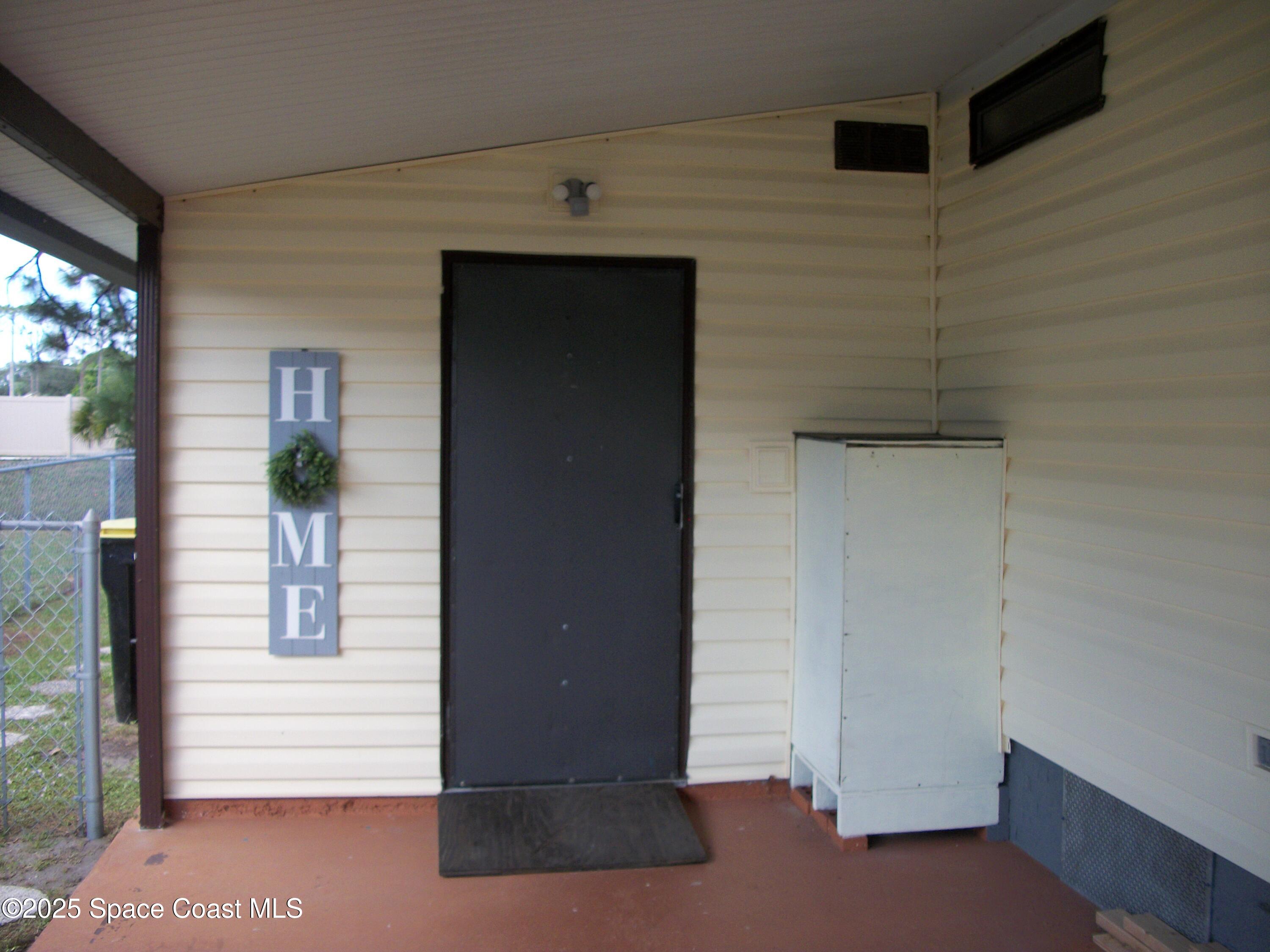 1972 Mango Street Northeast Palm Bay, FL 32905 - Photo 31 of 41 a view of a hallway of the house